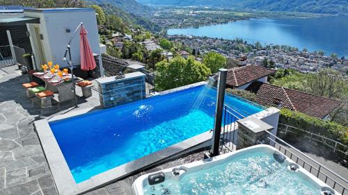 a swimming pool on top of a house at Casa Makatea in Brione sopra Minusio