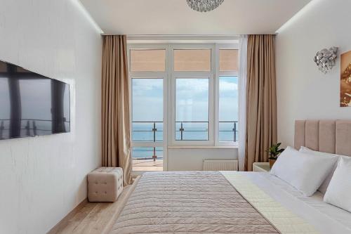 Postel nebo postele na pokoji v ubytování Direct sea view