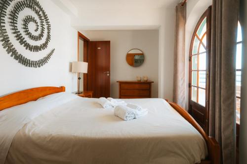 Postel nebo postele na pokoji v ubytování Alfaiate Beach House