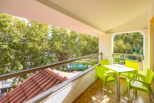 a balcony with a table and chairs at Clube do Lago Hotel in Estoril