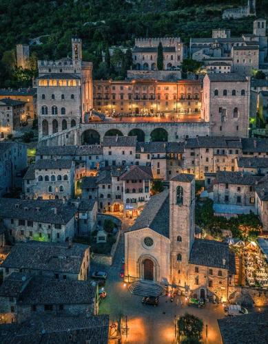 a view of a city at night at Casa Gianfranco in Gubbio
