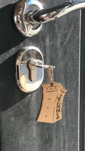 a metal key chain with a tag on it at Ninama in Mestia