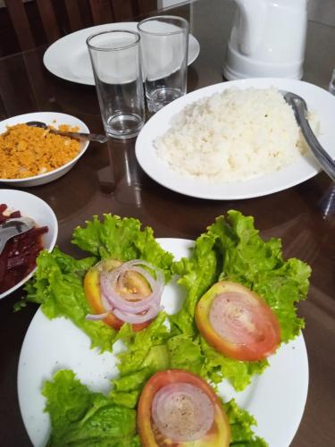 a plate of food with rice and vegetables on a table at Vino Villa Tourists & Local Accommodations - 24 Hrs in Kandy