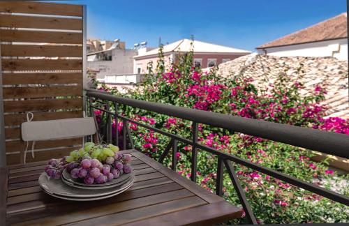 a plate of fruit on a table on a balcony at SEITAN PAZAR (Olive/Akrokeramos) in Preveza
