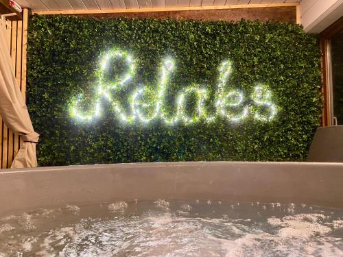 a sign that says baths in front of a bush at Apartamenty Jagodzianka - Jacuzzi, Sauna, Tężnia solankowa in Ustrzyki Dolne