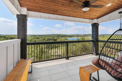 a screened porch with a hammock and a swing at Canary Lakehouse in Canyon Lake