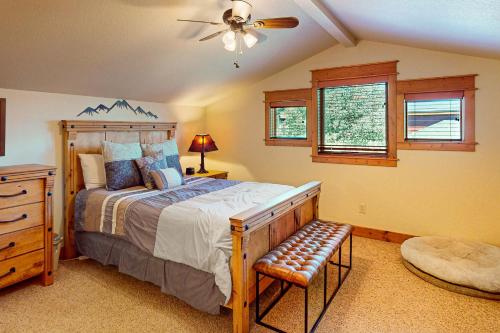 a bedroom with a bed and a ceiling fan at Running Bear in the Rockies #6145 in Estes Park