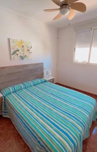 Postel nebo postele na pokoji v ubytování VARADERO OROPESA DEL MAR