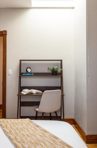 a bedroom with a desk and a chair at Spacious Stay near Yale in Downtown New Haven in New Haven