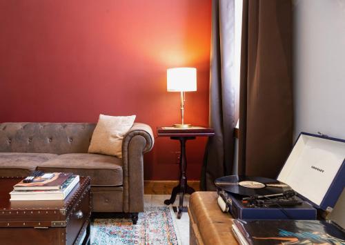 a living room with a couch and a table at Spacious Stay near Yale in Downtown New Haven in New Haven