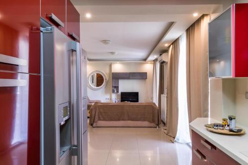 a room with a kitchen and a living room at Ionias Apartment in Heraklion in Heraklio