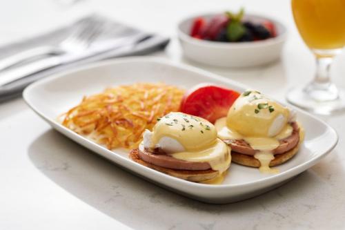 a plate of food with eggs and cheese and fruit at Crystal Gateway Marriott in Arlington