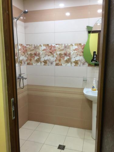 a bathroom with a shower and a sink at ARTDELUXE in Artashat