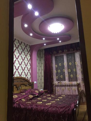 a bedroom with a large mirror on the ceiling at ARTDELUXE in Artashat