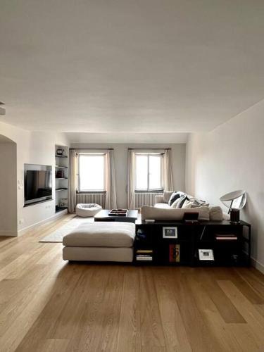 a living room with a large bed and a couch at La Perla di Boccadasse in Genova