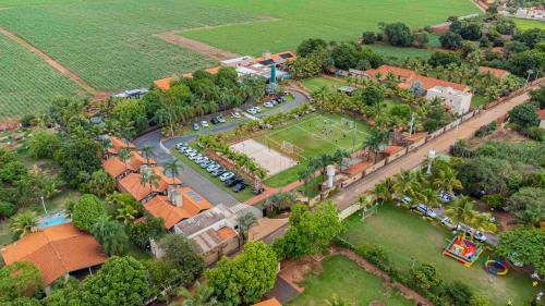 an overhead view of a park with cars parked at Carpe Diem Eco Resort Olímpia in Olímpia