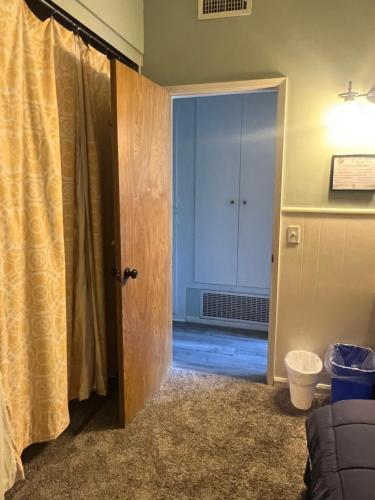 a room with a door open to a room with a door at COMFY COZY ROOM ON QUIET CUL-DE-SAC in Los Angeles