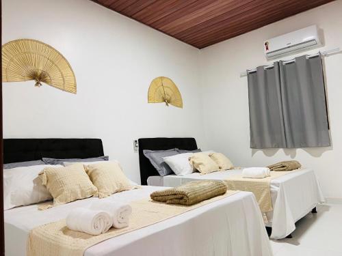 Кровать или кровати в номере Casa de Temporada - Praia Miaí de Baixo - Coruripe