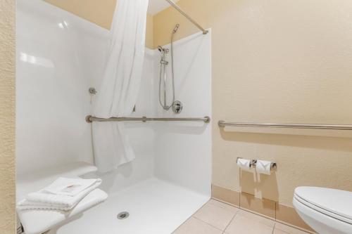 a bathroom with a shower and a toilet at Comfort Inn Arcata in Arcata