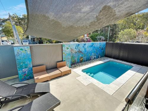 a swimming pool on the roof of a house at Baan Talay in North Haven