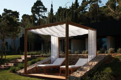 a gazebo with two chairs and a canopy at Lone Hotel by Maistra Collection in Rovinj