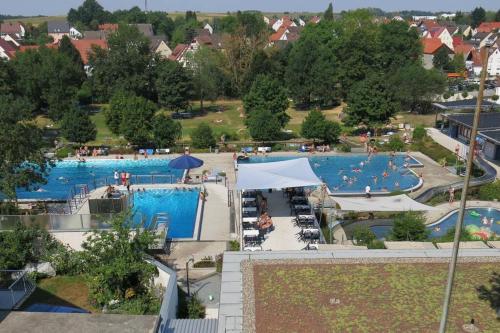 an overhead view of a large swimming pool at Sonnige Ferienwohnung Maja in Heroldsberg