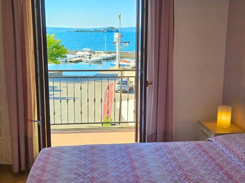 Katil atau katil-katil dalam bilik di Terrazza Vista Lago