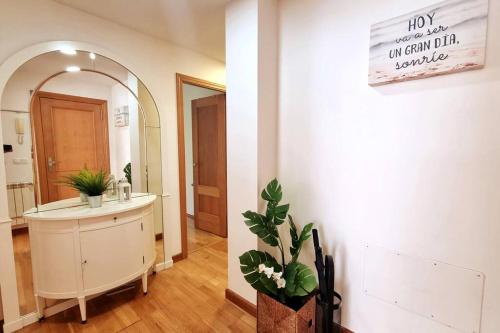 a bathroom with a sink and a mirror at Apartamento en Gama (Bárcena de Cicero) in Gama