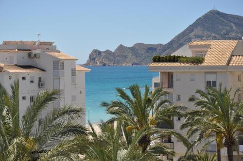 a view of the ocean from between two buildings at Penthouse with amazing terrace and Altea sea views in Altea