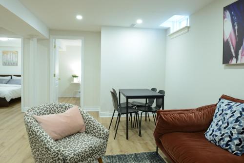 a living room with a couch and a table at Spacious 2-Bed-Room near Yonge & Major Mackenzie in Richmond Hill
