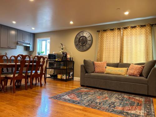 a living room with a couch and a table at San Francisco 3BR3BA w free parking near airport in Daly City