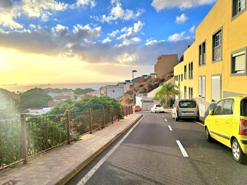 a street with cars parked on the side of the road at Casa Zicman Las Teresitas in San Andrés