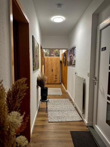 a hallway with two rugs on the floor of a house at Ferienwohnung E in Soltau