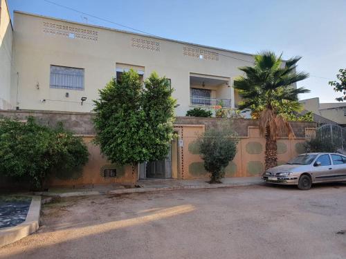 a car parked in front of a house at Bel appartement in Oujda