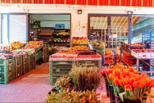 a grocery store filled with lots of fruits and vegetables at My city apartment vienna- one Bedroom in Vienna