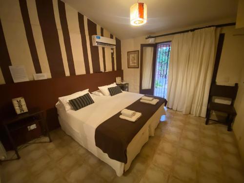 Кровать или кровати в номере Hotel Las Chirimoyas