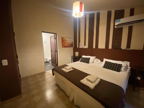 Кровать или кровати в номере Hotel Las Chirimoyas