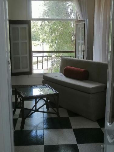 a living room with a couch and a coffee table at Rezeiky Hotel & Camp in Luxor