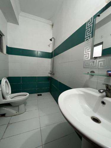 a bathroom with a sink and a toilet at Balcony View/Aesthetic One bedroom Apartment in Islamabad