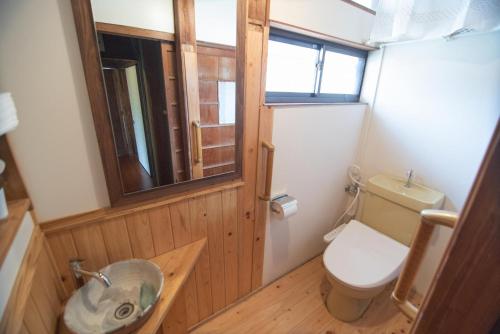 a small bathroom with a toilet and a sink at Yamaganorizou - Vacation STAY 02773v in Yamaga