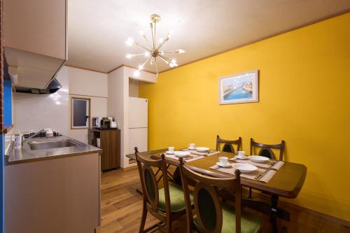 a kitchen and dining room with a table and chairs at Total 107square meter 4min to nearest staion Max16pp in Tokyo