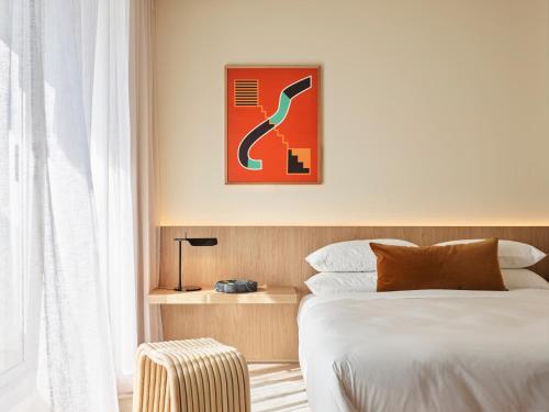 a hotel room with a bed and a chair at Oxford House in Sydney