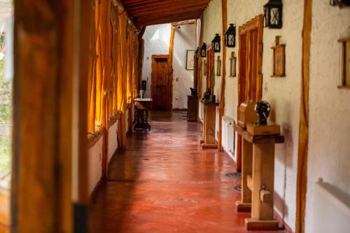a hallway of a house with a long floor and a room at Santuario del Río in San José de Maipo