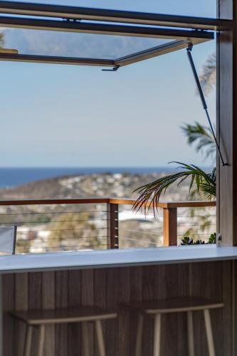 a balcony with a view of the ocean at Hillcrest Merimbula in Merimbula