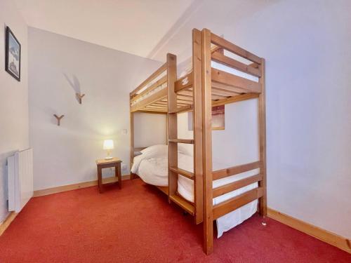 a bedroom with a bunk bed with a ladder at Appartement Notre-Dame-de-Bellecombe, 3 pièces, 6 personnes - FR-1-505-192 in Notre-Dame-de-Bellecombe