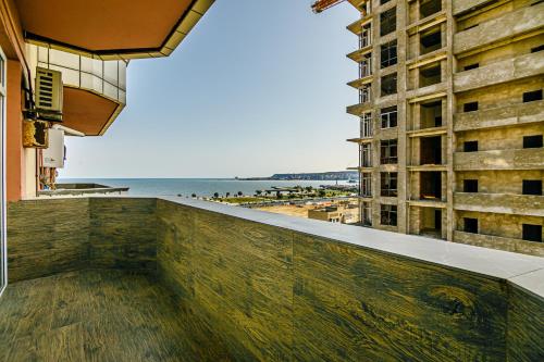a view of the beach from the balcony of a building at Baku Sea View 3 bedroom in Baku