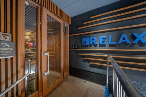 a hallway with a fire lab sign on the wall at Relax Hotel Takayama Station in Takayama