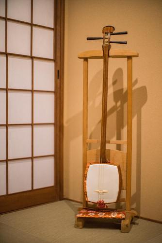 a lantern with a cross on top of it at 京町　朱雀 in Kyoto
