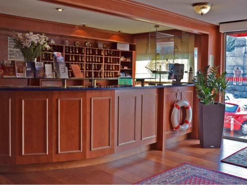 a bar in a store with a counter at Botel Albatros in Prague