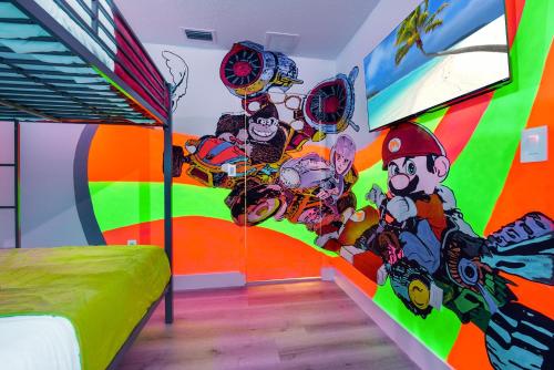 a bedroom with a colorful mural on the wall at Flamingo's Resort 5 Bdrooms Gameroom Heated Pool in Miami